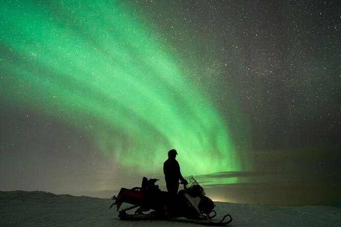 3 Hours Snowmobiling under Auroras and Night Sky - The tipi and campfire stop: Finnish sausages and real warmth