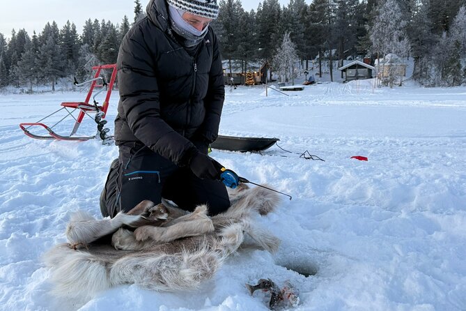 Authentic Reindeer Experience and Ice Fish with Lunch in the Wild - Ice fishing in winter: drill, wait, and watch for the bite