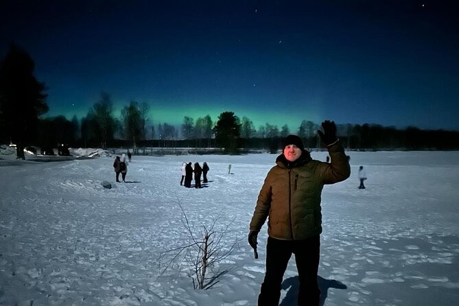From Rovaniemi: Northern Lights Tour with Campfire Snacks - Olkkajärvi Lake camp: grilled sausages, rice pies, and warm drinks by the fire