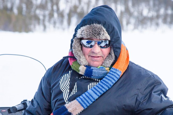 From Saariselkä: Ice Fishing Tour to Lake Inari, reindeers &lunch - The sled ride out to the frozen lake is part of the show