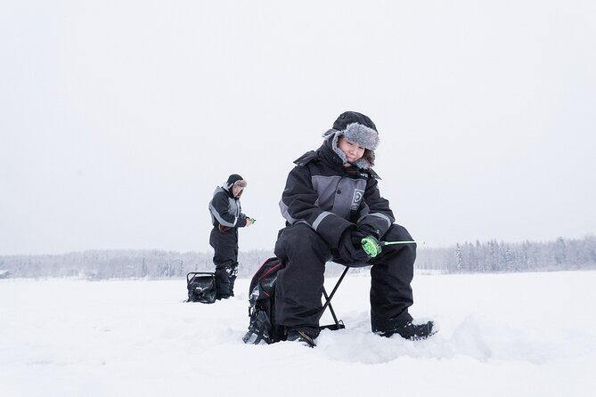 Ice Fishing on a Frozen Lake in Levi - Drilling the hole and how ice fishing actually works on the lake