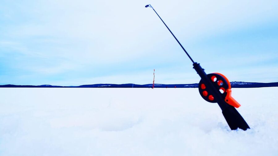 Ice fishing program in Lapland - The guide, English instruction, and photo-stop confidence