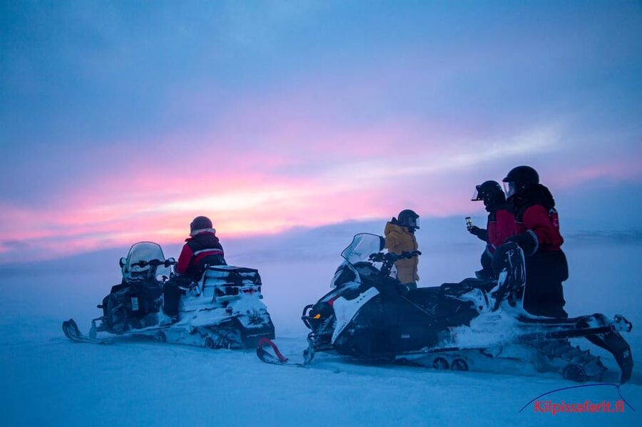 Kilpisjärvi: Border of Three Countries Snowmobile Safari - The best riding moments on frozen lake ice and snowy birch forest