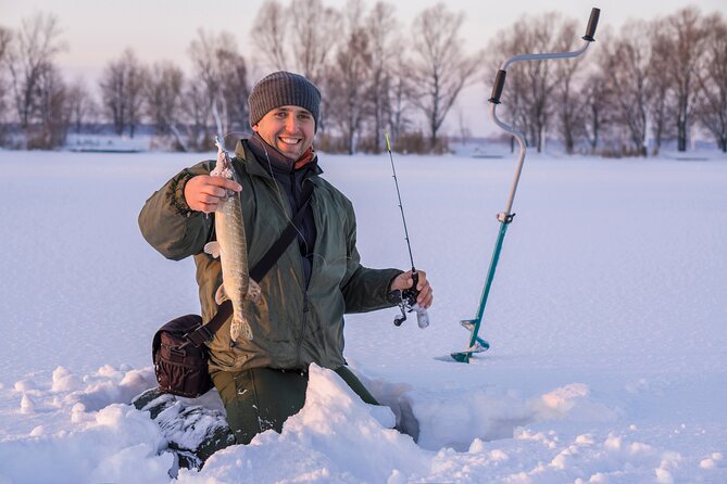 Lapland Ice Fishing Experience from Rovaniemi - Ice Drilling and Fishing Setup on a Frozen Lake