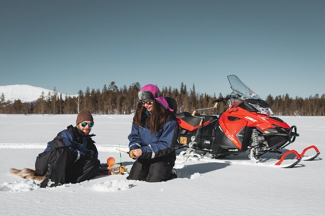 Lappish Lunch Break -Snowmobiling, ice fishing and tasty food - The snowmobile ride: frozen rivers, icy fields, and a guided pace