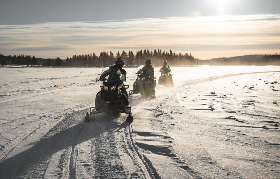 Rovaniemi: Electric Snowmobile Safari Tour with Ice Fishing - Your guide leads the ice fishing lesson, drilling holes and reading winter