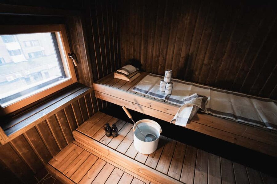 Rovaniemi: Private Sauna and Lounge - The lounge zone: fridge, microwave, and luggage storage