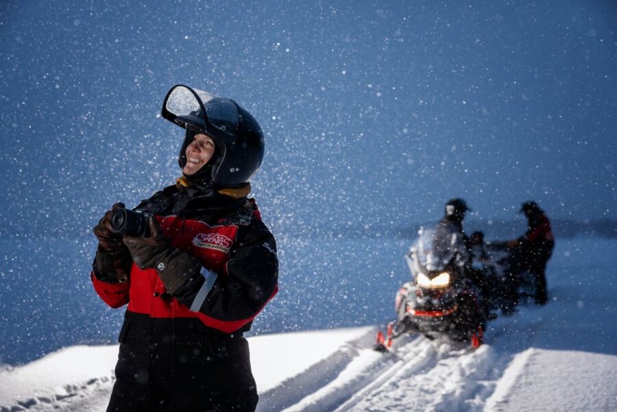 Ruka: Starlight sledging to search for Northern Lights - Your main ride: sledging through Ruka’s winter forest on a snowmobile