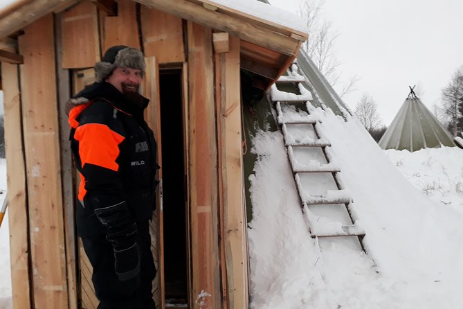 Snowmobile Safari to Lake Inari, meet & feed Reindeers, Lunch - Lunch by open fire in a wilderness teepee